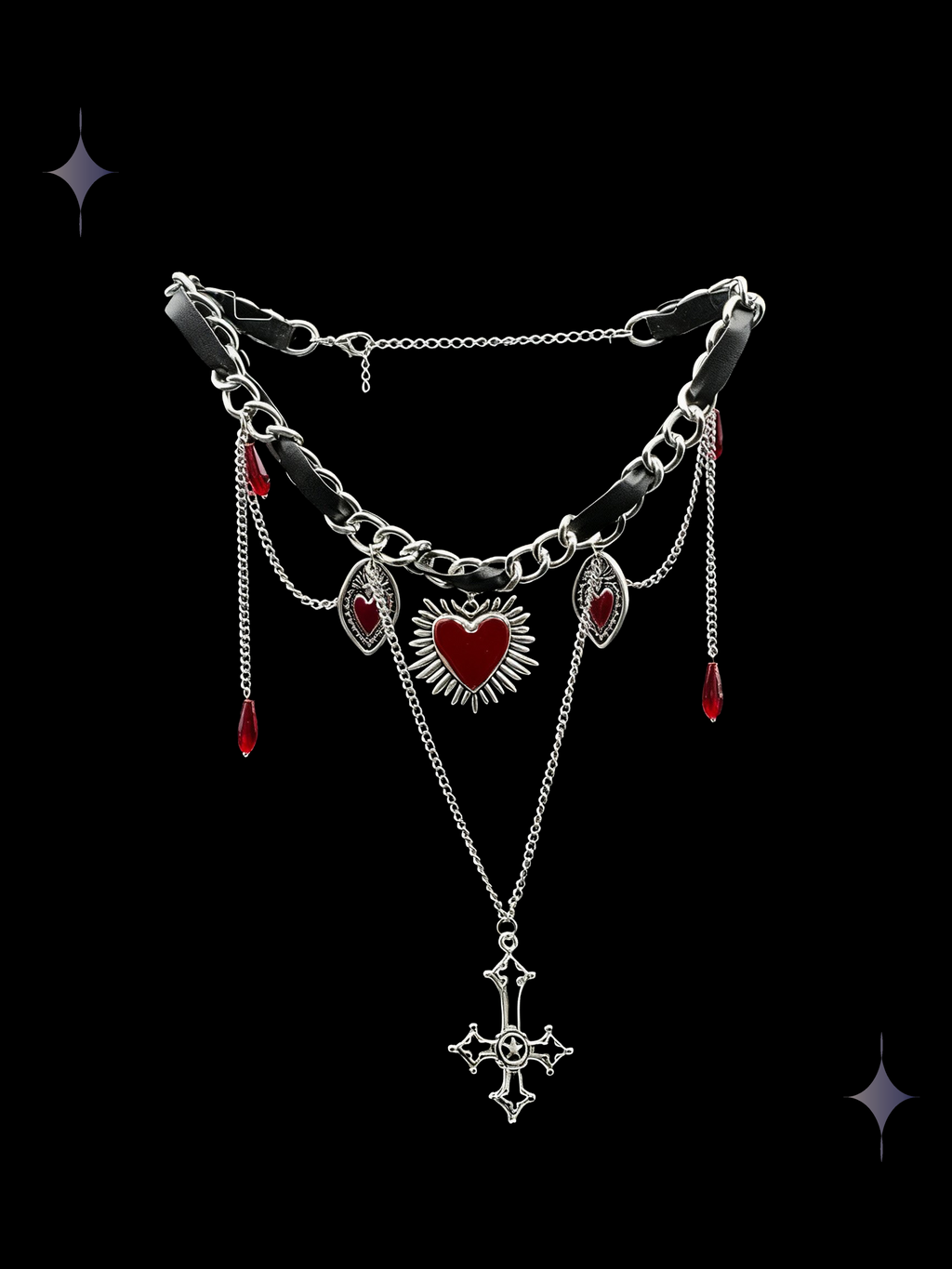 Blood Oath layered gothic necklace with black ribbon, chunky silver-tone chains, red heart charms, faux-crystal drops, and an ornate cross pendant on a black background