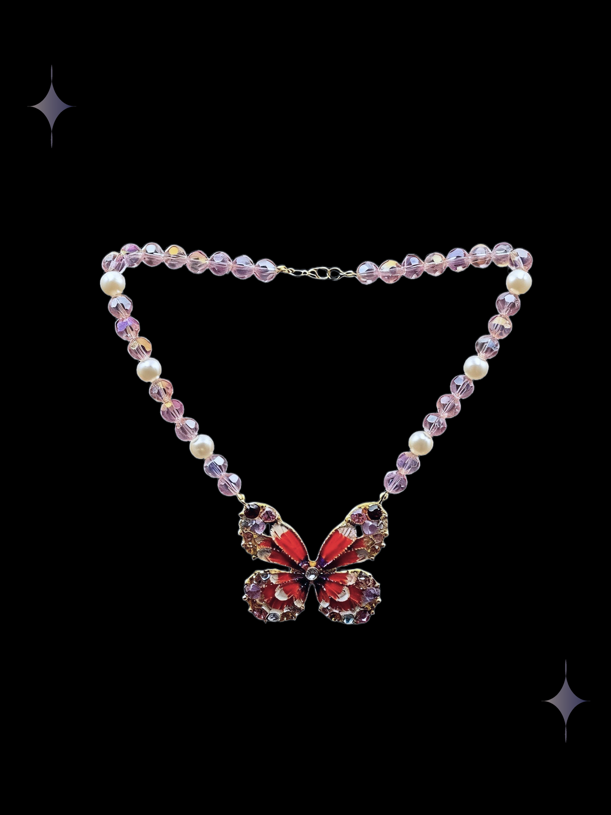 Crimson Butterfly Y2K red butterfly beaded necklace with rose-pink crystal beads, faux pearl accents, and a sparkling butterfly centerpiece on a black background