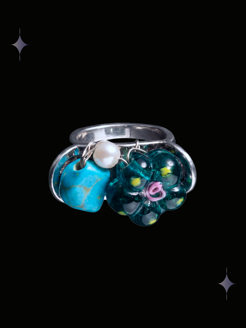 Handcrafted turquoise teal flower Y2K ring with blue turquoise-style stone, translucent green floral beads, pearl accent and silver-tone wirework on a black background