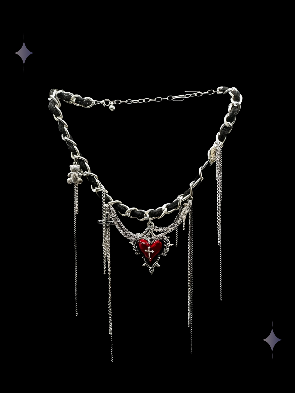 Heartfall Chain red gothic heart layered chain necklace with a red heart centerpiece, cross charms, silver-tone links, and long chain fringe on a black background