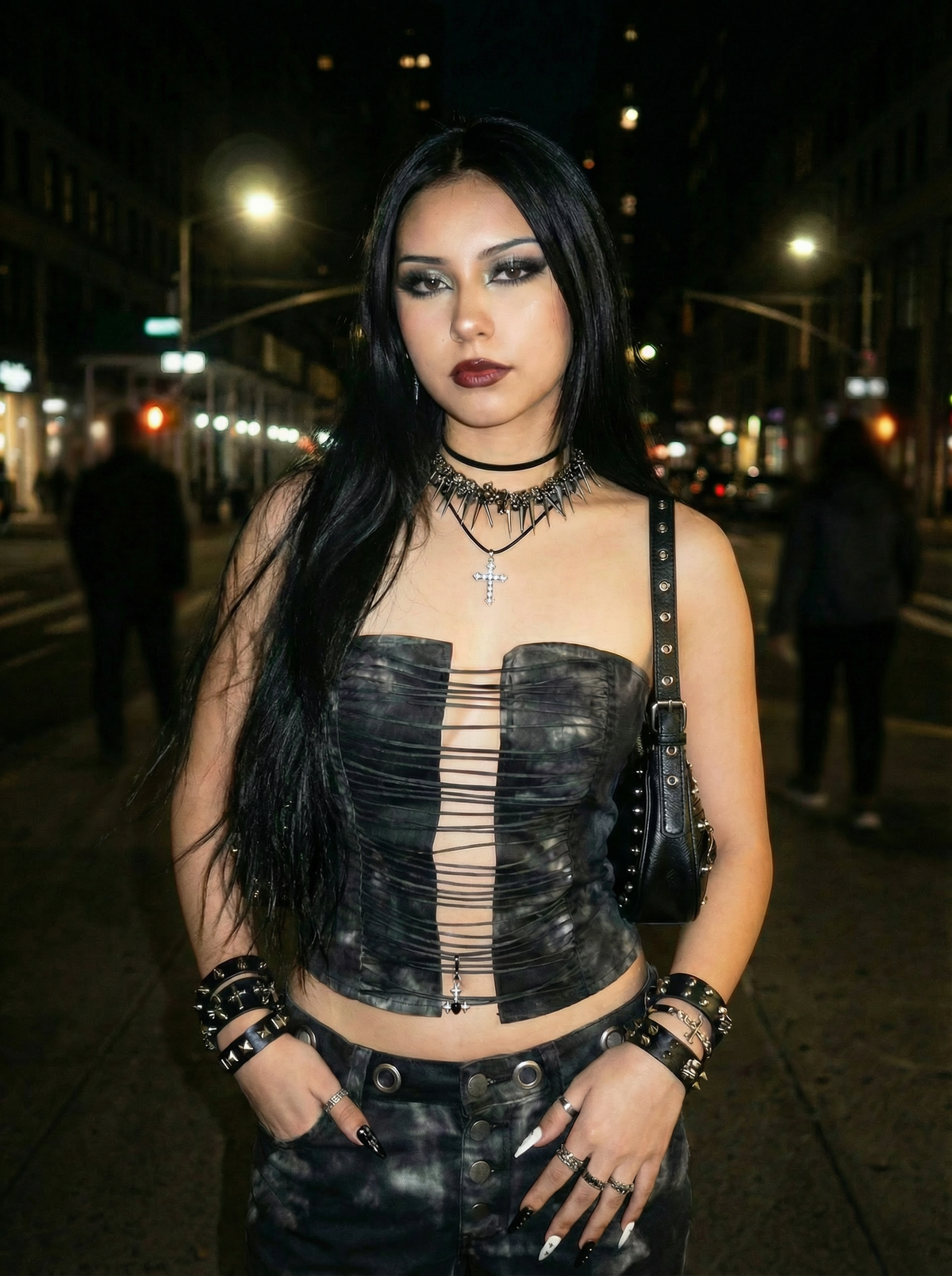 Model wearing the Iron Frenzy gothic spike chain necklace in a nighttime city setting