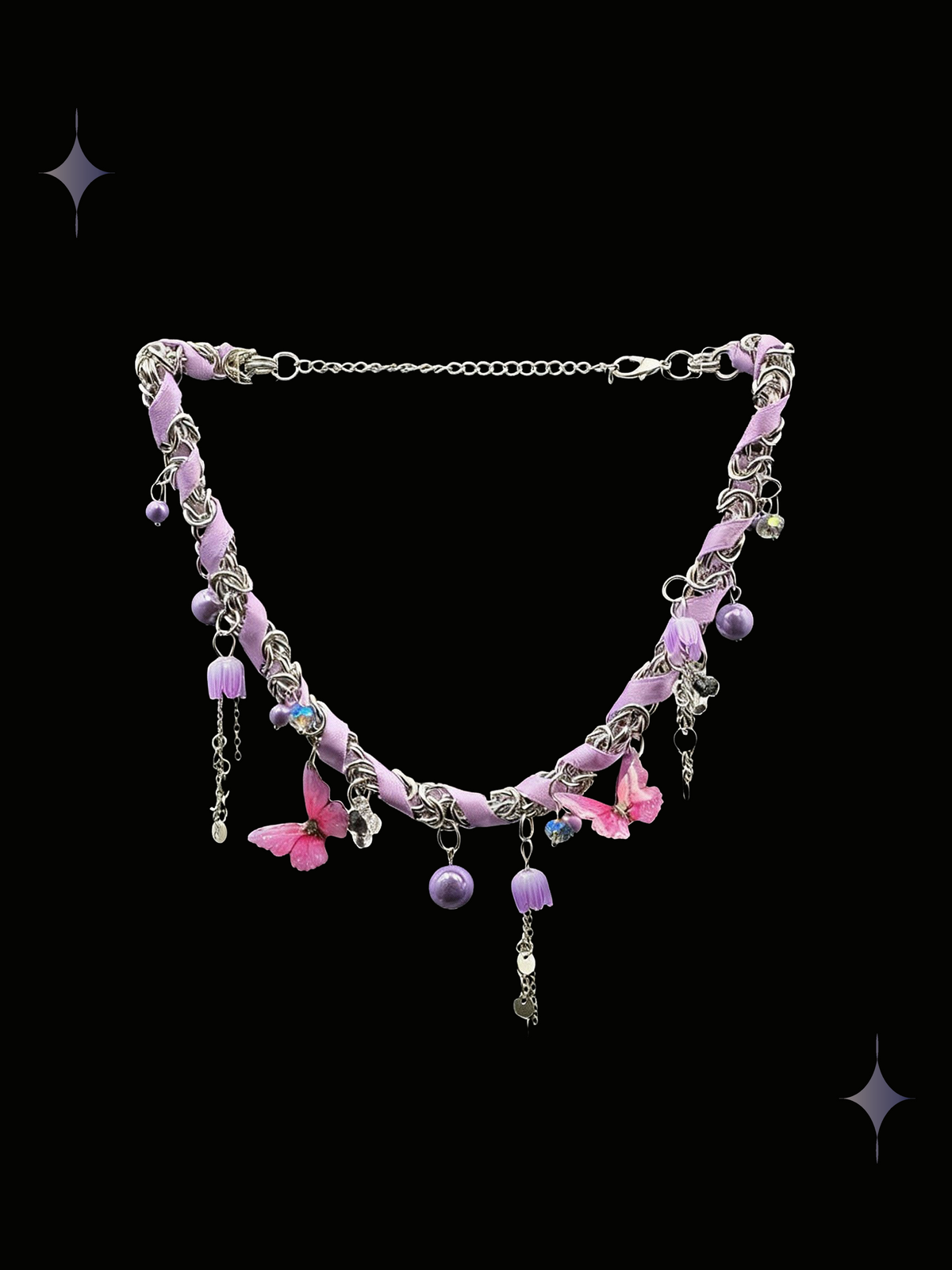 Starlit Petal pink floral charm necklace with lavender beads, ribbon details, and dangling silver-tone accents on a black background