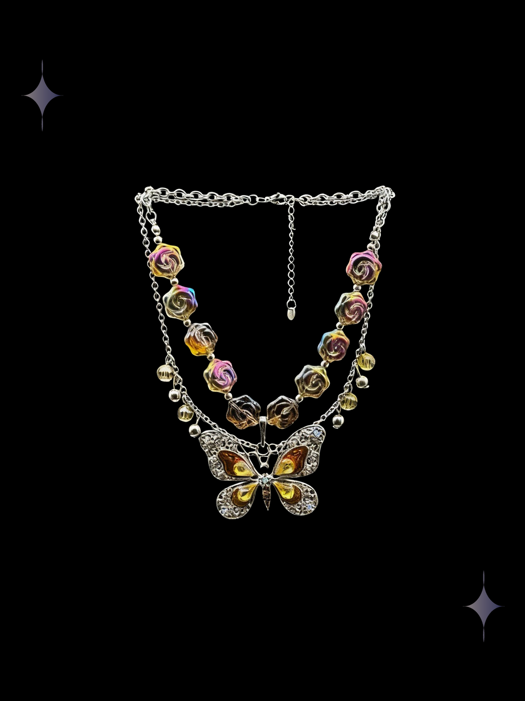 Sunset Glitter Y2K gold butterfly beaded necklace with colorful rose beads, layered chains, and charm details on a black background